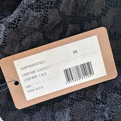Clothing tag with product details on a black background