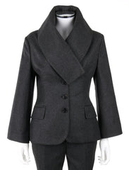 A black double-breasted blazer with a wide shawl collar, displayed on a mannequin torso against a plain white background.