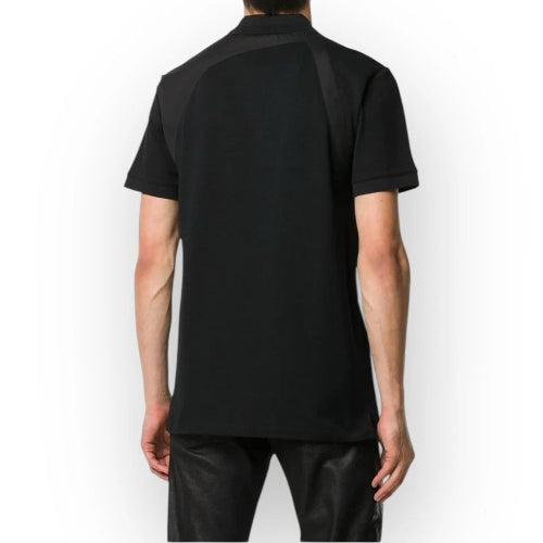 Person wearing a black t-shirt on a white background