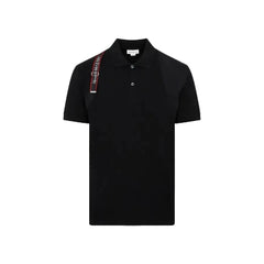 Black polo shirt with a strap on a light gray background