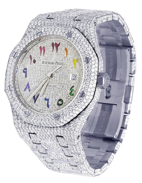 Luxury watch with diamond-studded case and colorful face on a white background
