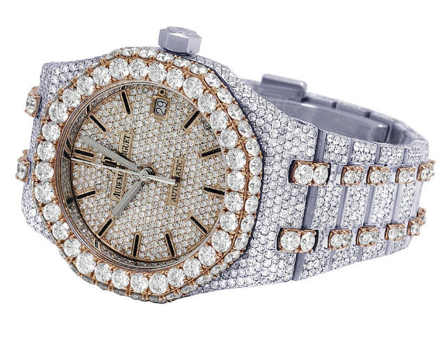 Luxury watch with diamond-studded case and band on a white background