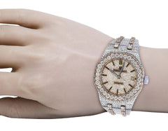 Luxury diamond-encrusted watch on a hand against a white background