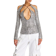Silver sequin top with long sleeves and a plunging neckline on a plain background