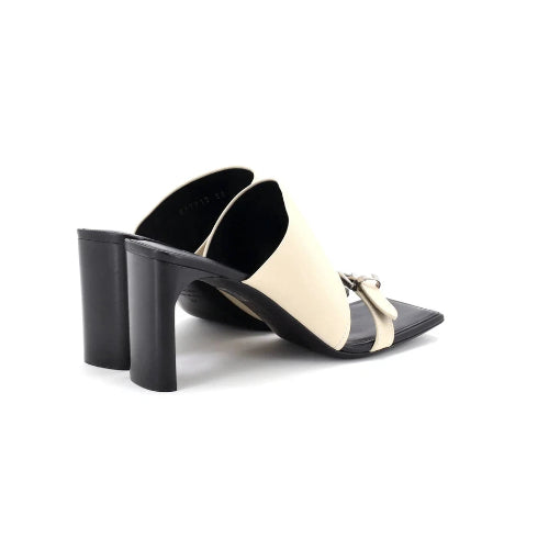 Black and beige high-heeled shoes on a white background