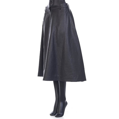 Black leather skirt worn by a person on a white background
