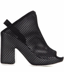 Black perforated high-heeled shoes on a white background
