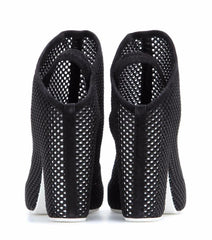 Black high-heeled shoes with open-toe design on a white background