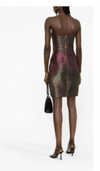 Woman wearing a strapless, iridescent dress on a white background