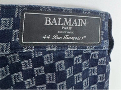 Balmain label on a patterned fabric background