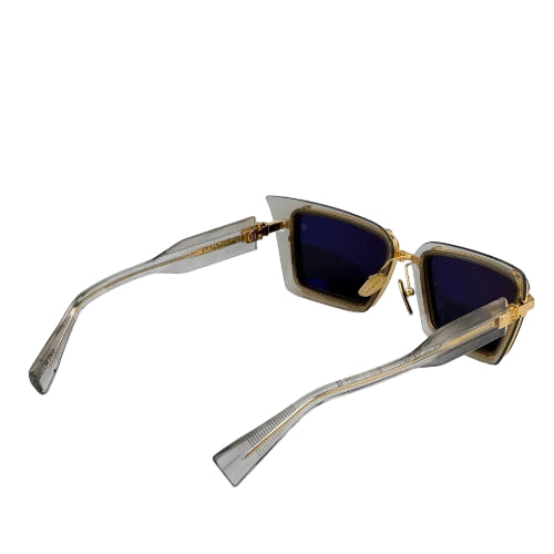 Sunglasses with gold and silver frame on a white background
