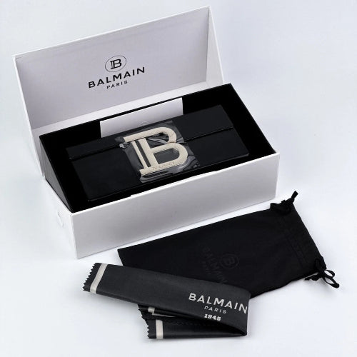 Balmain Paris belt buckle set with packaging on a white background