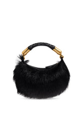 A black fur crescent shoulder bag with a braided black handle and gold-tone hardware, shown against a plain white background.