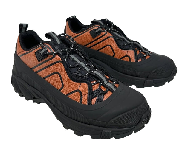 Pair of black and brown hiking boots on a white background