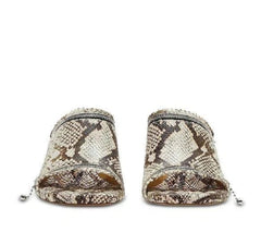 Snake skin patterned shoes on a white background