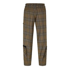 A pair of plaid trousers in a brown, beige, and black tartan pattern with subtle orange lines, shown against a light gray background.