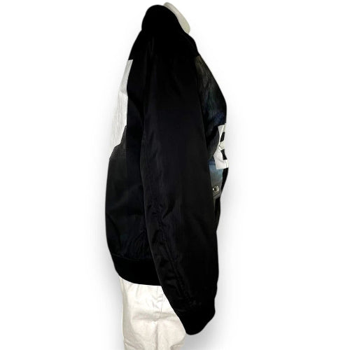 A long, straight black wig displayed on a white mannequin head against a plain white background.