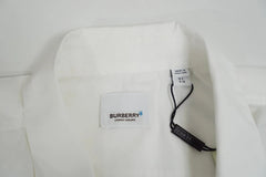 Close-up of a white Burberry shirt collar showing the white Burberry brand label, a size tag, and a black hangtag.