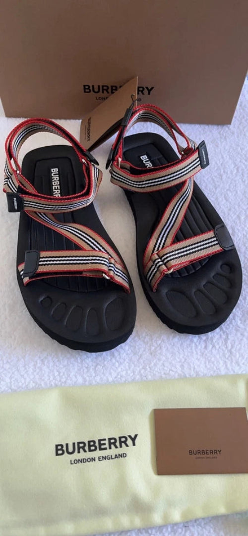 Burberry sandals with packaging on a white surface