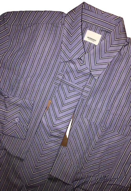 A close-up of a purple and white vertically striped button-down shirt, showing the collar and fabric texture.