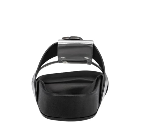 Black sandal with a metallic buckle on a white background