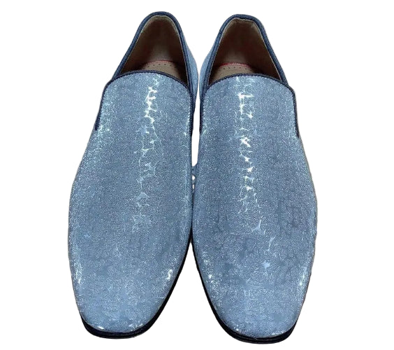 Pair of blue glittery loafers on a cardboard box