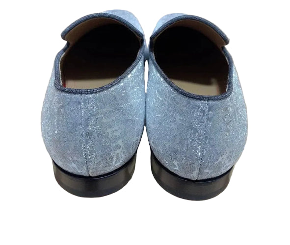 Pair of gray loafers on a cardboard box