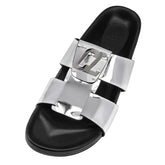 Black slide sandal with silver buckle on a white background