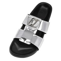 Black slide sandal with silver buckle on a white background