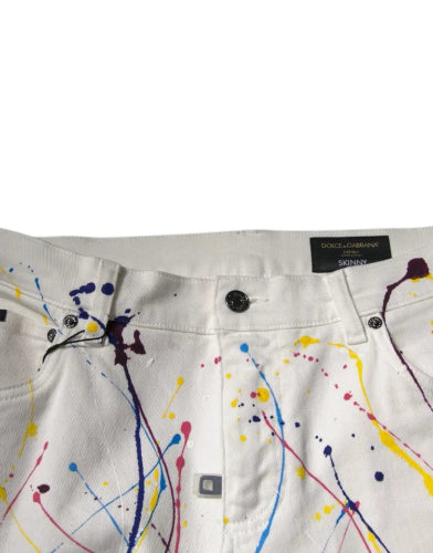 White pants with colorful paint splashes and a brand label on a white background