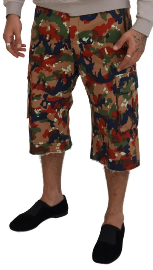 Camouflage shorts worn by a person on a white background
