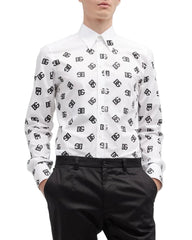 Person wearing a white shirt with black pattern and black pants on a white background