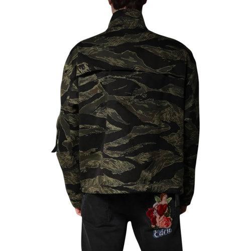 Camouflage jacket worn by a person on a white background