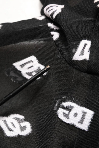 Black socks with white logos arranged on a white background