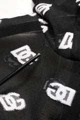 Black socks with white logos arranged on a white background