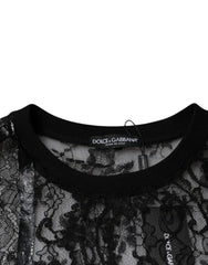 Dolce & Gabbana label on a black lace garment with a white background