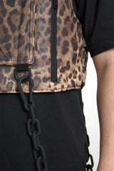 Leopard print vest with black chain detail on a plain background