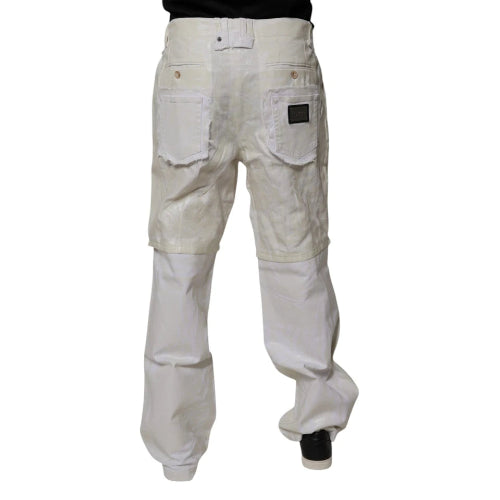 A pair of off-white canvas work pants with darker beige reinforced knee patches, shown from the back on a model against a white background.