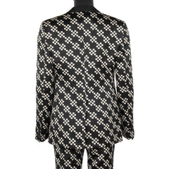 Black and white checkered suit jacket on a mannequin against a white background