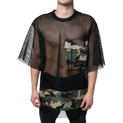 Person wearing a black mesh shirt with camouflage patterns on a white background