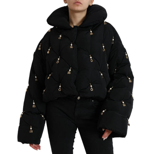 Black puffer jacket with gold buttons on a white background