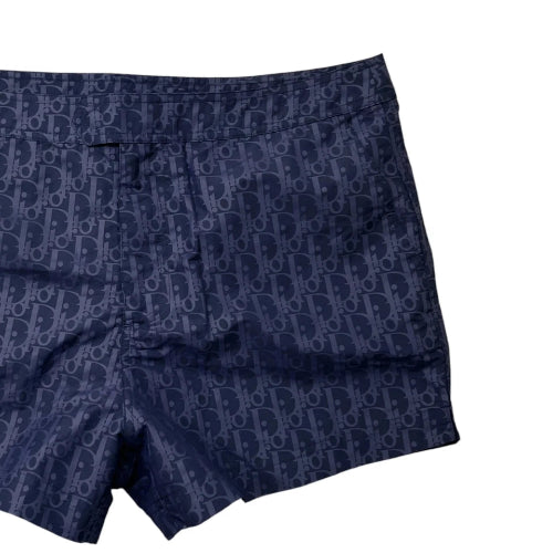 Navy blue boxer briefs with a pattern on a white background