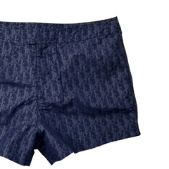 Navy blue boxer briefs with a pattern on a white background
