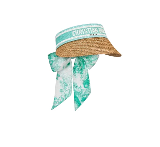 Woven sun hat with a green band and matching scarf on a light gray background
