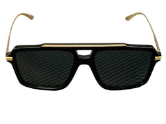 Black sunglasses with gold accents on a textured gray background