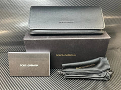 Dolce & Gabbana wallet with packaging on a textured surface