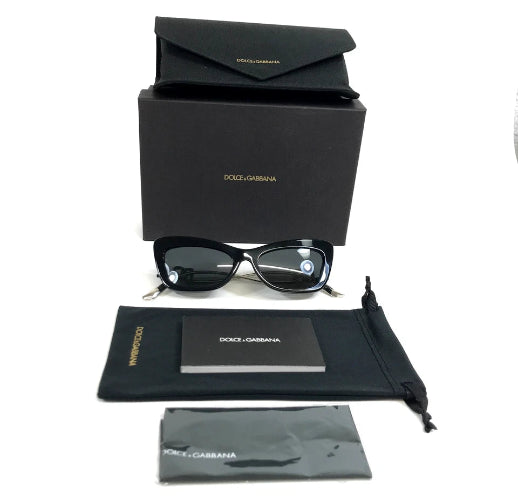 Collection of eyeglasses, case, and cleaning cloth with a brand logo.