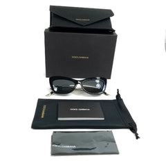 Collection of eyeglasses, case, and cleaning cloth with a brand logo.