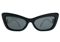Black cat-eye sunglasses with dark lenses on a white background
