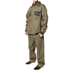 Olive green shirt and pants set on a white background